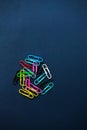 Multi coloured paper clips on plain background Royalty Free Stock Photo