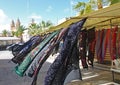 Multi coloured patterned silk scarves blowing in the breeze on a market stall in Marsaxlokk in Malta