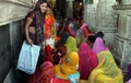 Multi-coloured saris of worshippers inside Jagdish Mandir temple in Udaipur, India