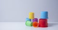 Multi-coloured stacking cups for a baby.balance concept Royalty Free Stock Photo