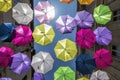 Multi coloured umbrellas as street art in Arles, Provence, South of France