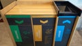 Multi-compartment recycling stations are designed to separate different types of waste. Royalty Free Stock Photo