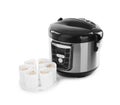 Multi cooker with cups of banana yogurt Royalty Free Stock Photo