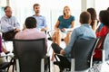 Multi-Cultural Office Staff Sitting Having Meeting Together Royalty Free Stock Photo