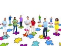 Multi-Ethinic People Standing On Jigsaw Puzzle Pieces