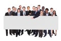 Multi ethnic Business people Holding Blank Billboard Royalty Free Stock Photo