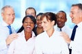 Multi ethnic business people posing together. Portrait of multi ethnic business people posing together. Royalty Free Stock Photo