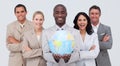 Multi-ethnic business team holding a terrestrial g Royalty Free Stock Photo