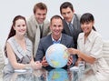 Multi-ethnic business team holding a terrestrial g Royalty Free Stock Photo