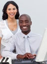 Multi-ethnic business team working at a computer Royalty Free Stock Photo