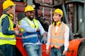 Multi ethnic cargo contianer workers stand and relax with happiness during work in workplace area Royalty Free Stock Photo