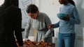 Multi ethnic colleagues playing with foosball game table Royalty Free Stock Photo