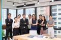 Multi ethnic confident business group crossing arms in modern office Royalty Free Stock Photo