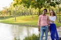 Multi ethnic couple thinking while standing on stone path in the Royalty Free Stock Photo