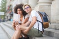 Multi-ethnic couple tourists with map in city Royalty Free Stock Photo