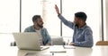 Multi ethnic friends workmates giving high five