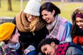 Beautiful young people sitting together in the park Royalty Free Stock Photo