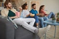 Multi Ethnic Group of Friends Watching Movies at Home Royalty Free Stock Photo