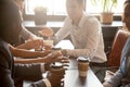 Multi ethnic group of friends drinking coffee together in cafe Royalty Free Stock Photo