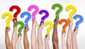 Multi-Ethnic Group of Human Hands Holding Question Marks