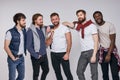multi-ethnic group of men in casual urban style clothes posing at camera Royalty Free Stock Photo