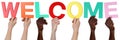 Multi ethnic group of people holding the word welcome Royalty Free Stock Photo