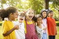 Multiethnic group of school children laughing and embracing Royalty Free Stock Photo