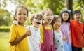 Multiethnic group of school children laughing and embracing Royalty Free Stock Photo