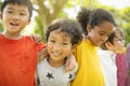 Multiethnic group of school children laughing and embracing Royalty Free Stock Photo