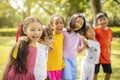 Multiethnic group of school children laughing and embracing Royalty Free Stock Photo