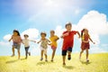 Multiethnic group of school children laughing and running