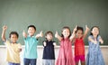 Multiethnic group of school children standing in classroom