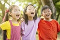 Multiethnic group of school kids laughing and embracing Royalty Free Stock Photo