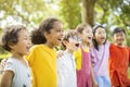 Multiethnic group of school kids laughing and embracing Royalty Free Stock Photo