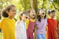 Multiethnic group of school kids laughing and embracing Royalty Free Stock Photo