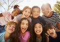 Multi-ethnic group of schoolchildren on school trip, smiling Royalty Free Stock Photo