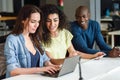 Multi-ethnic group of young people studying with laptop computer Royalty Free Stock Photo