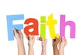 Multi-Ethnic Hands Holding The Word Faith Royalty Free Stock Photo