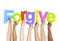 Multi-Ethnic Hands Holding The Word Forgive Royalty Free Stock Photo