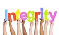 Multi-Ethnic Hands Holding The Word Integrity Royalty Free Stock Photo