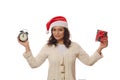 Multi-ethnic happy woman in Santa hat, with Christmas present and retro alarm clock showing midnight on the face clock Royalty Free Stock Photo