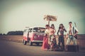 Multi-ethnic hippie hitchhikers Royalty Free Stock Photo