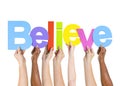 Multi Ethnic People Holding The Word Believe Royalty Free Stock Photo