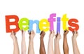 Multi Ethnic People Holding The Word Benefits Royalty Free Stock Photo
