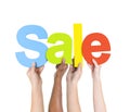 Multi Ethnic People Holding The Word Sale Royalty Free Stock Photo