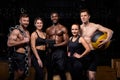 multi-ethnic people posing at camera with sportive equipment for cross fit Royalty Free Stock Photo