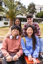 Multi ethnic portrait of young group of happy student friends smiling at camera Royalty Free Stock Photo