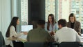 Multi-ethnic team of start-up entrepreneurs, software engineers, have meeting in the modern office conference room Royalty Free Stock Photo