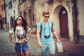 Multi ethnic tourists couple with map in old city Royalty Free Stock Photo