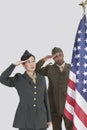 Multi-ethnic US military officers saluting American flag over gray background Royalty Free Stock Photo